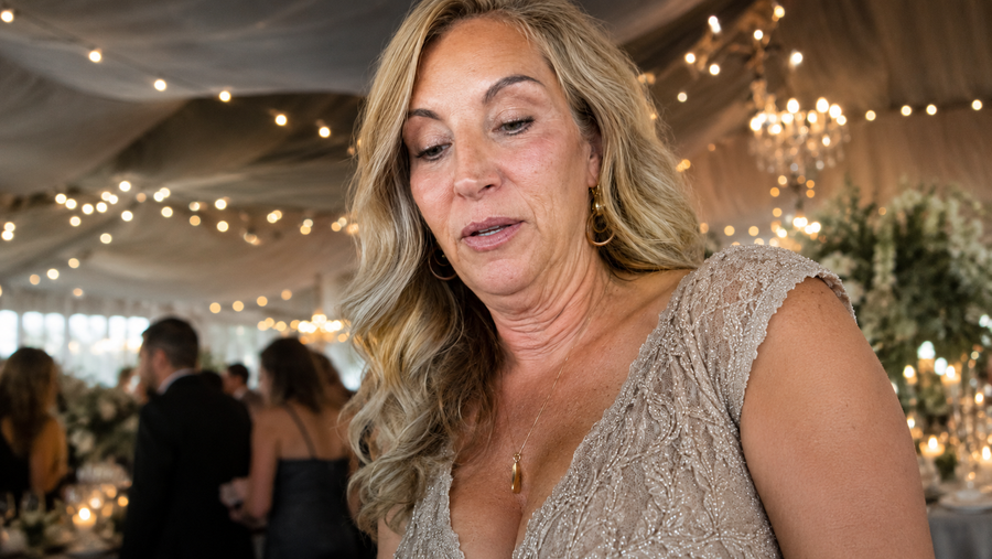 Carol at her daughter's wedding, looking down, the moment in the photo that changed everything